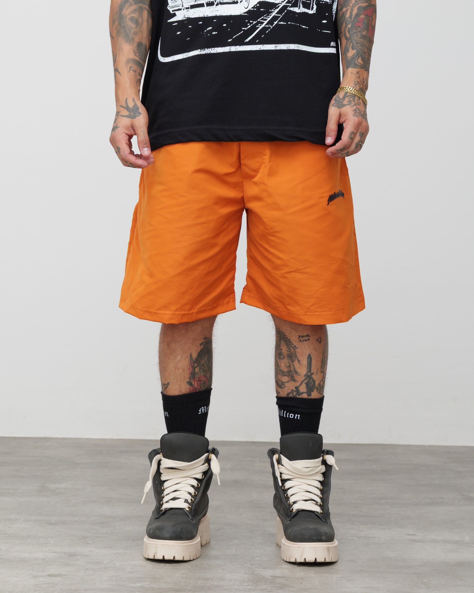 Shorts Tech Arancio - Logo Nero
